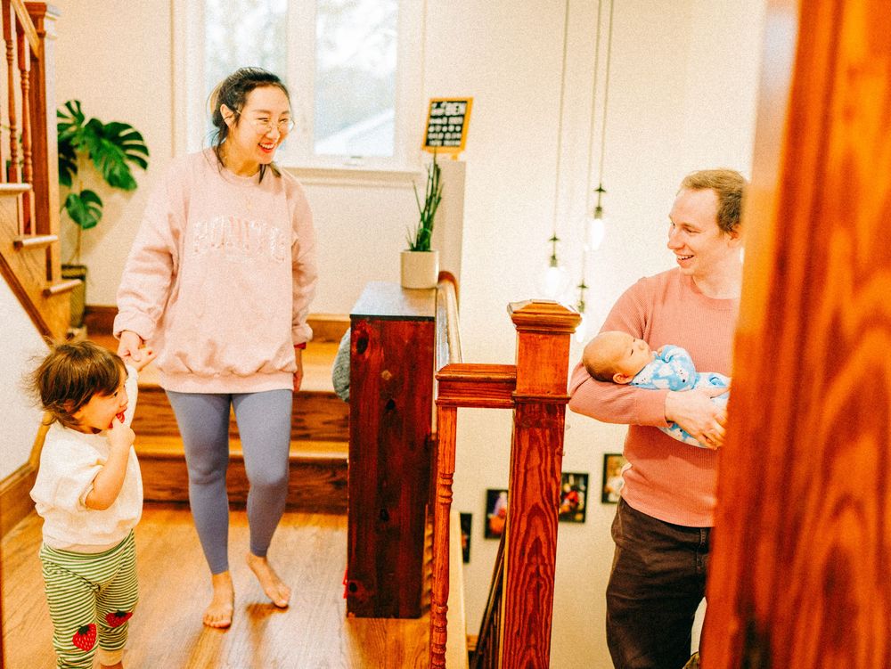 A series of photos showing a parent and child practicing a daily routine near a door frame at home.