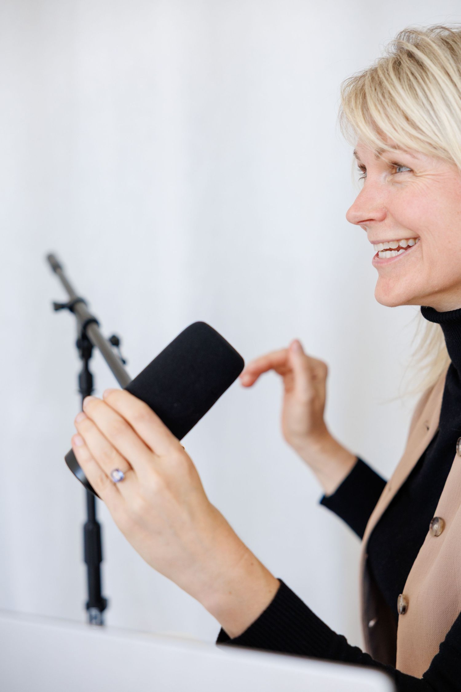 A series of photos showing a person in black clothing holding and interacting with a small toy penguin figure.