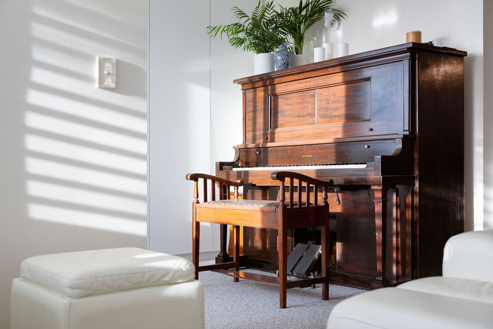 A collection of upright pianos in various rooms showing different angles and perspectives of the instruments.
