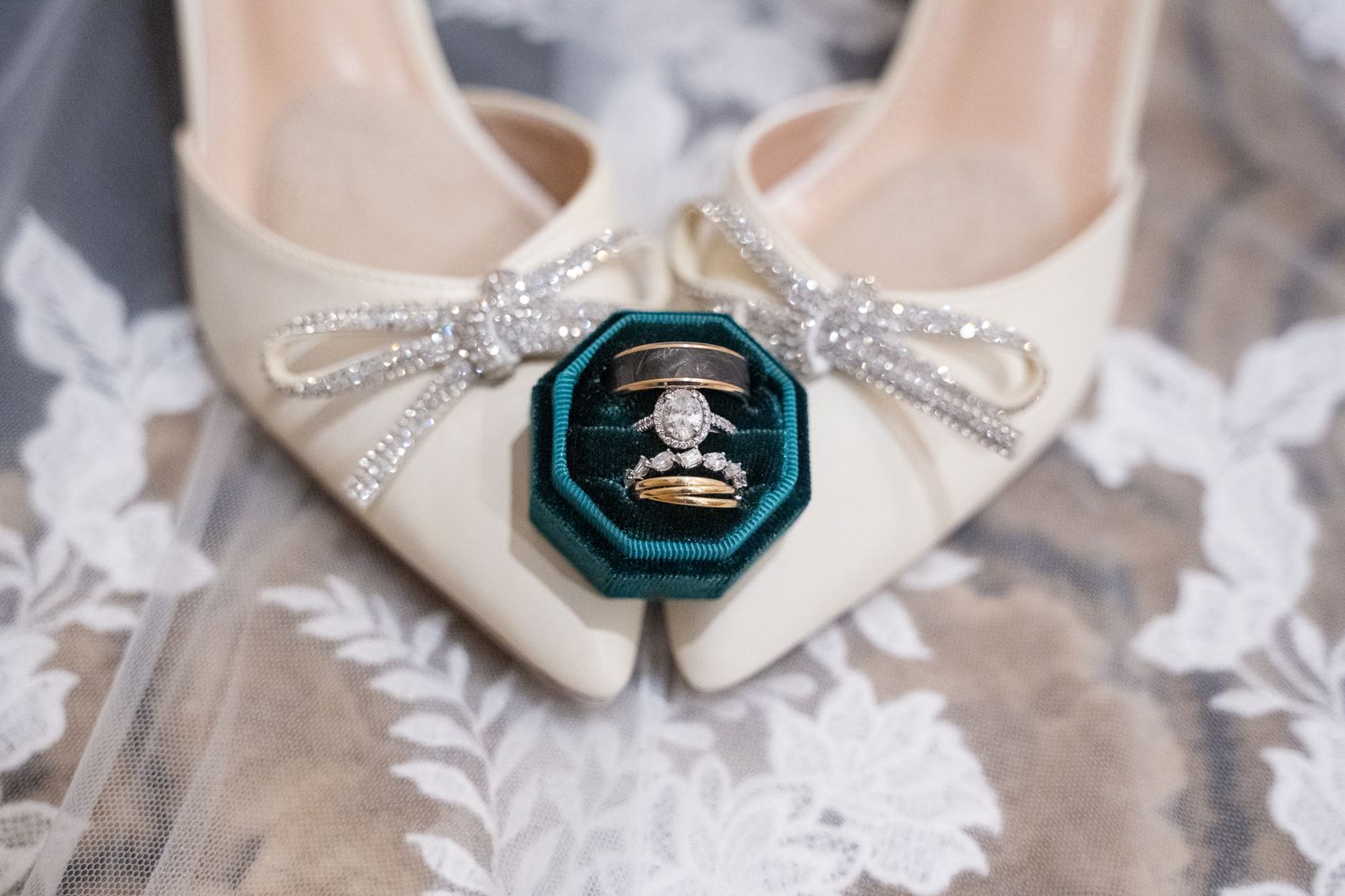 Wedding details collage showing rings, invitations, shoes, and accessories arranged in a romantic vintage style.