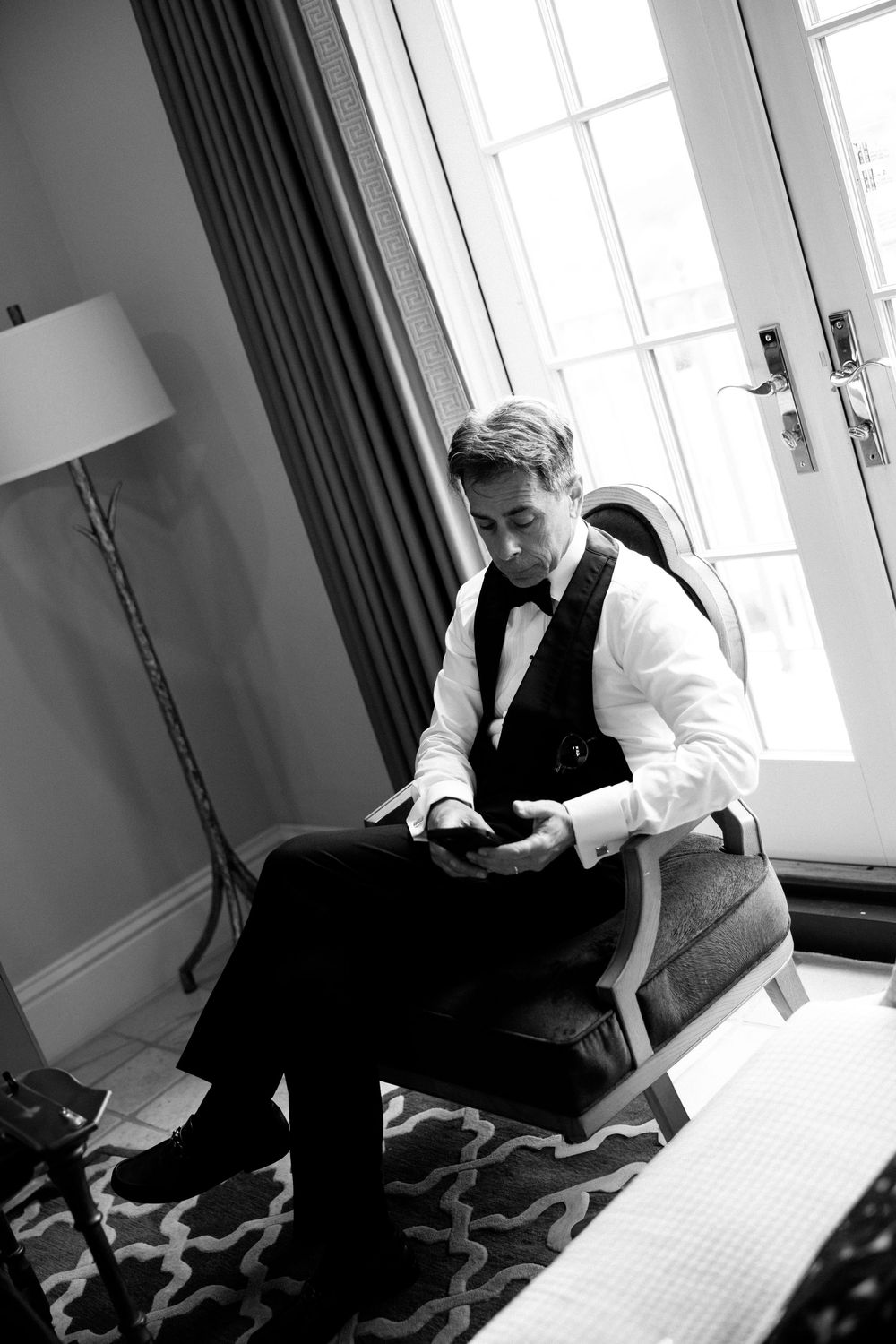 Black and white photo sequence showing contemplative moments in an interior room with geometric patterned carpet.