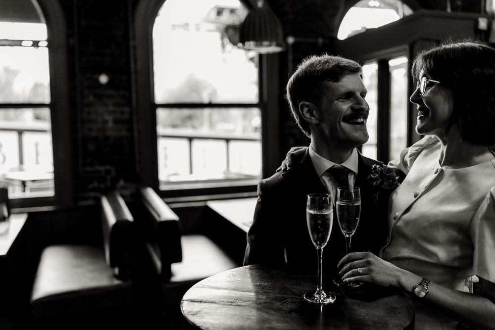 Black and white film strip showing romantic couple moments in vintage style photography.