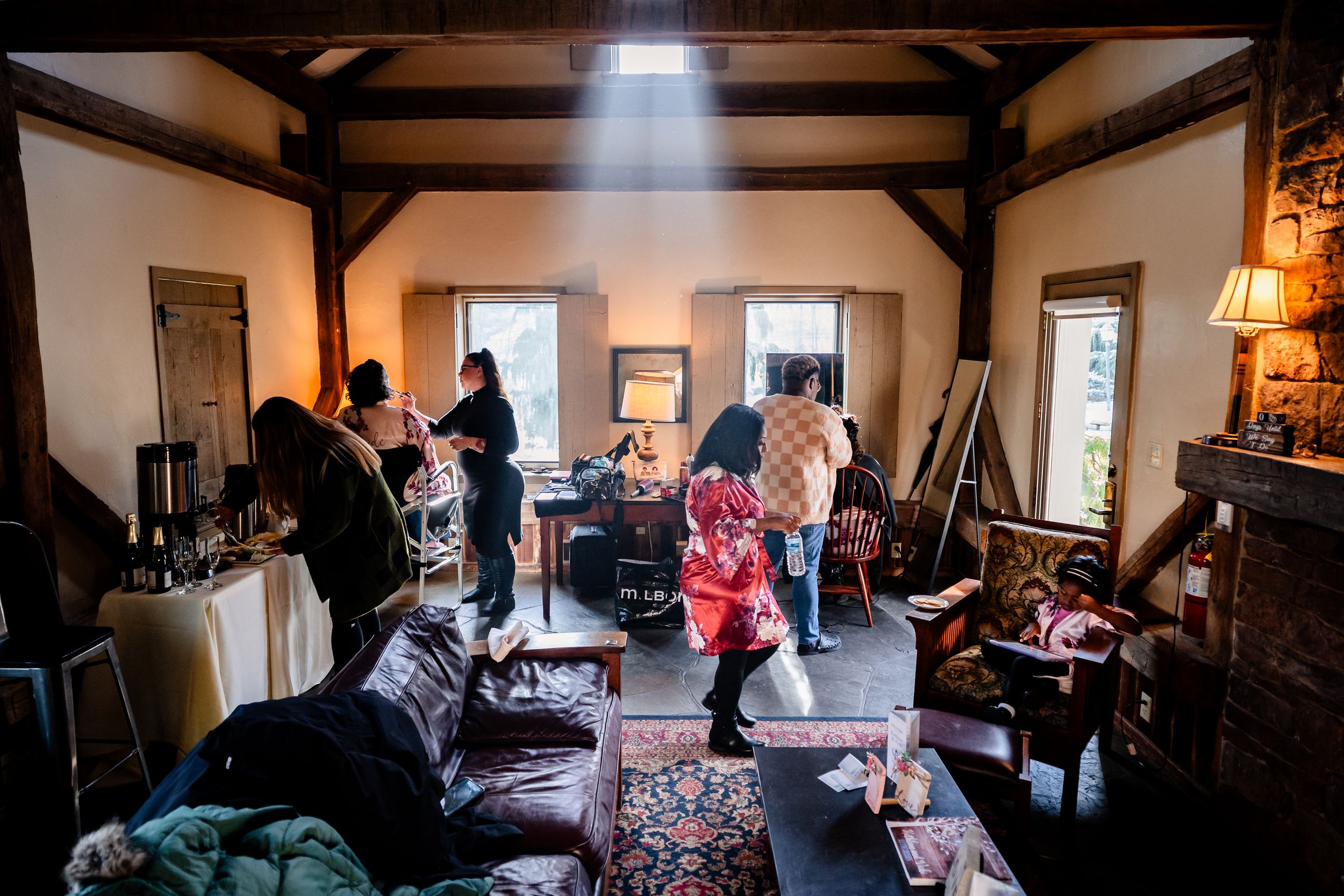 A sequence of interior room photos showing people gathered in what appears to be a social or community event setting.