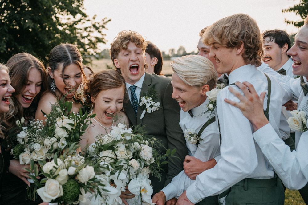A series of candid wedding moments showing joyful reactions and celebrations with white floral arrangements.