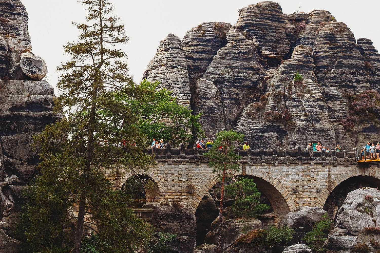 Rocky sandstone formations and hiking trails at Bastei Bridge in Saxon Switzerland National Park.