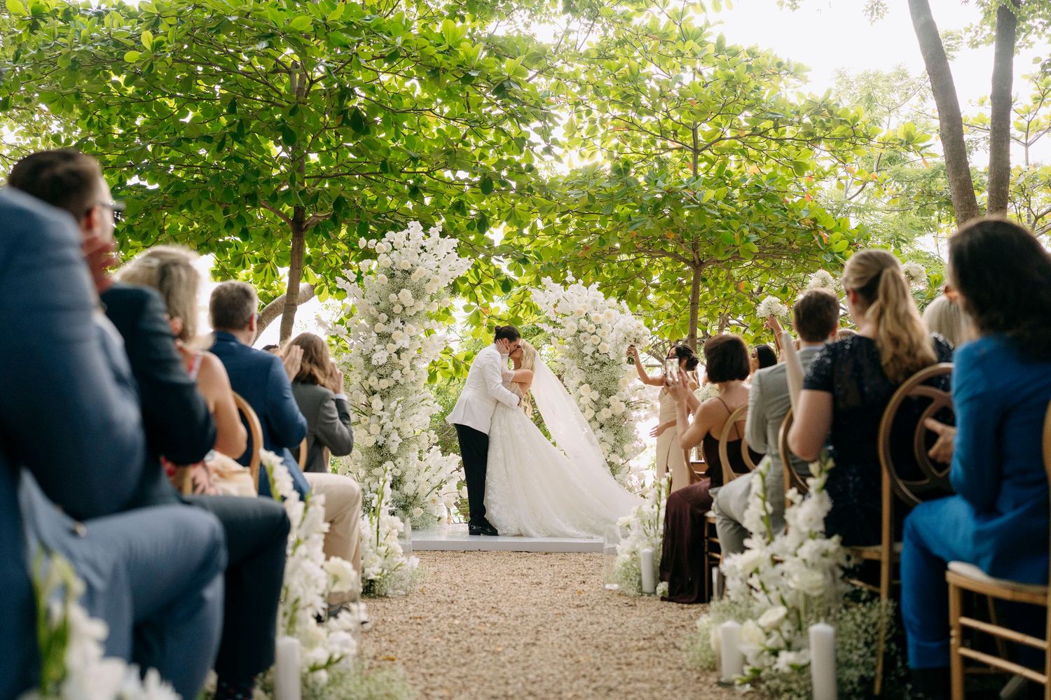 couple sharing kiss on their ceremony in las catalinas