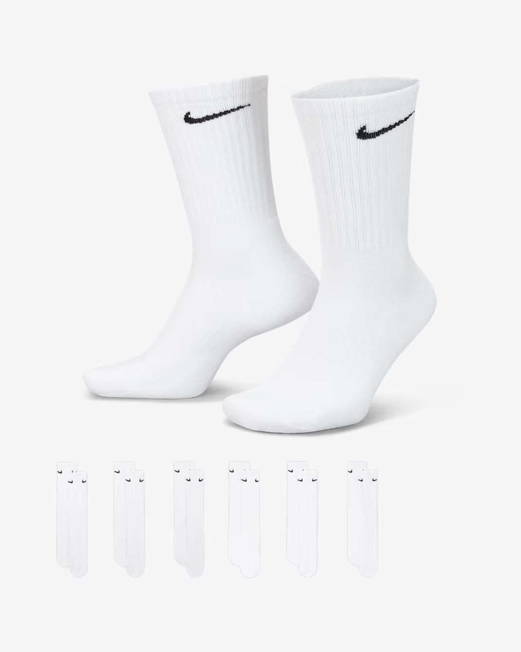 White Nike athletic quarter socks with swoosh logo displayed from multiple angles against white background.