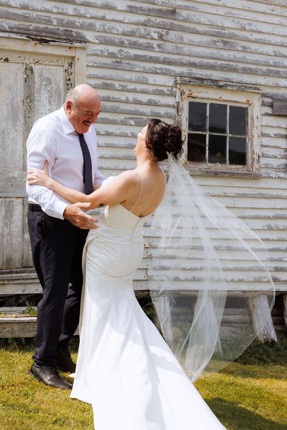 Brides first look with dad in Trinity captured by Newfoundland documentary style wedding photographer Kaitlyn Yvette