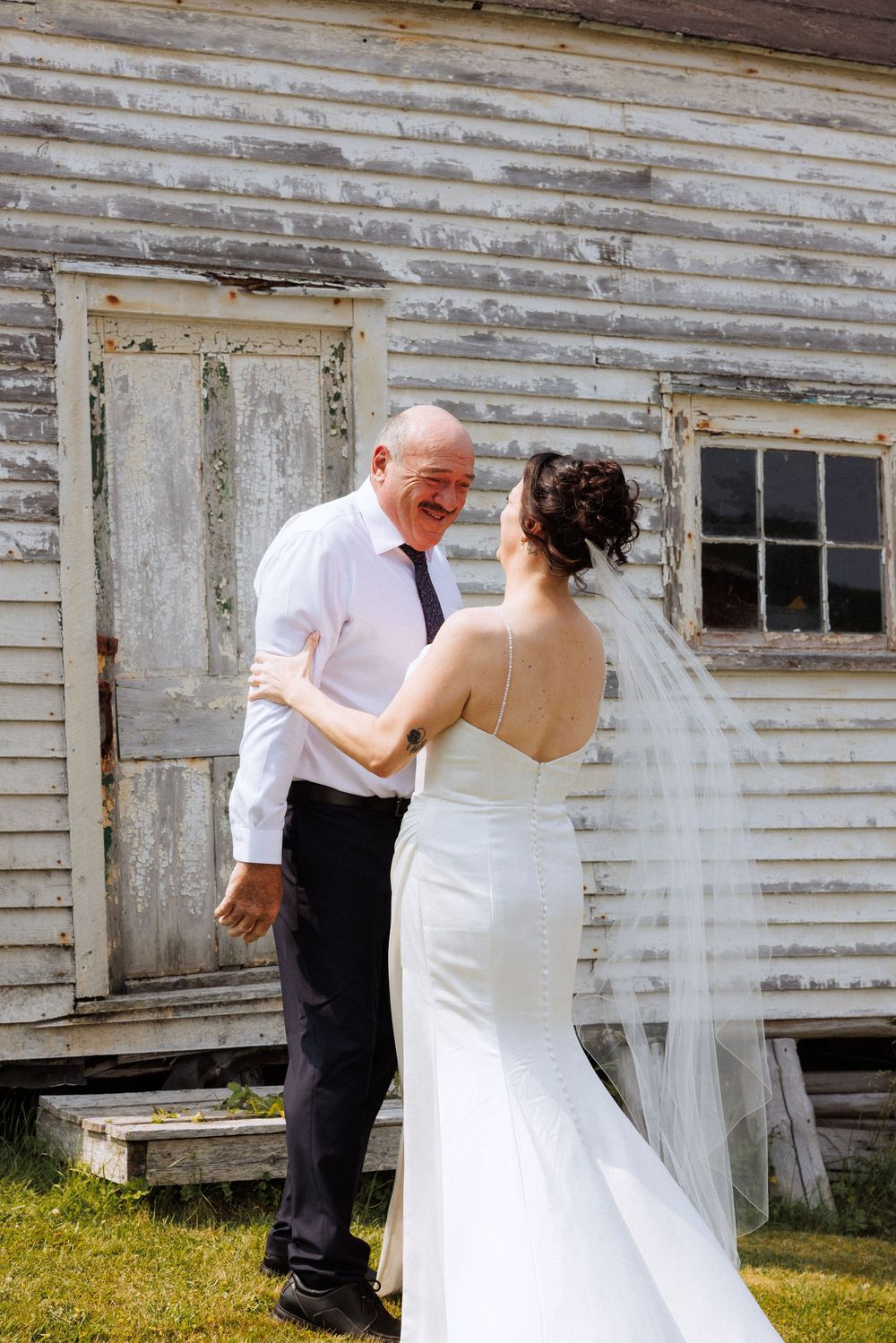 Bride and groom with family in Trinity captured by Newfoundland documentary style wedding photographer Kaitlyn Yvette
