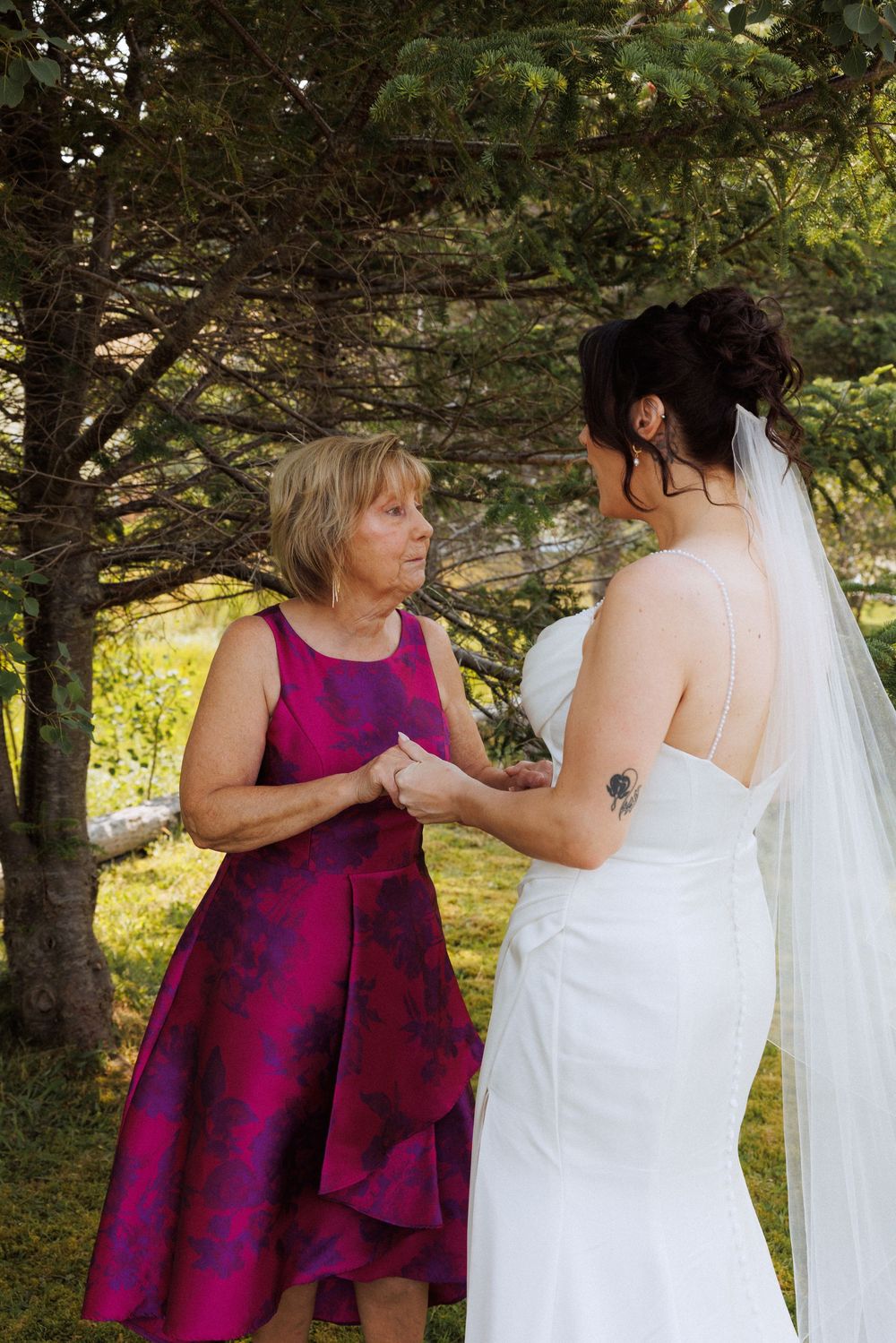 Wedding couple with family in Trinity captured by Newfoundland documentary style wedding photographer Kaitlyn Yvette