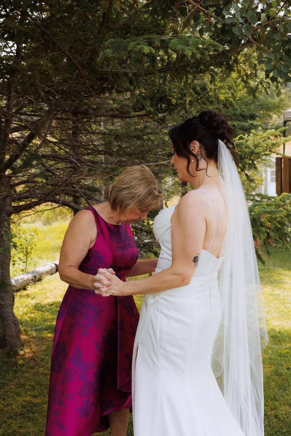 Wedding couple with family in Trinity captured by Newfoundland documentary style wedding photographer Kaitlyn Yvette