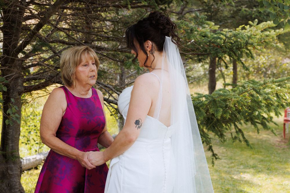 Wedding couple with family in Trinity captured by Newfoundland documentary style wedding photographer Kaitlyn Yvette