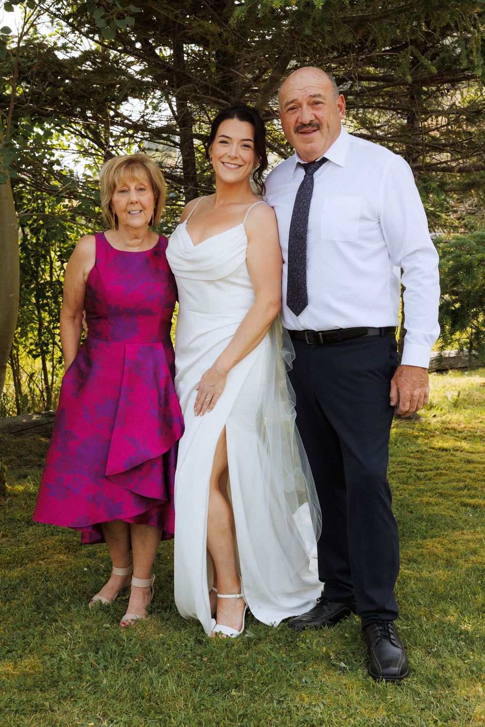 Wedding couple with family in Trinity captured by Newfoundland documentary style wedding photographer Kaitlyn Yvette