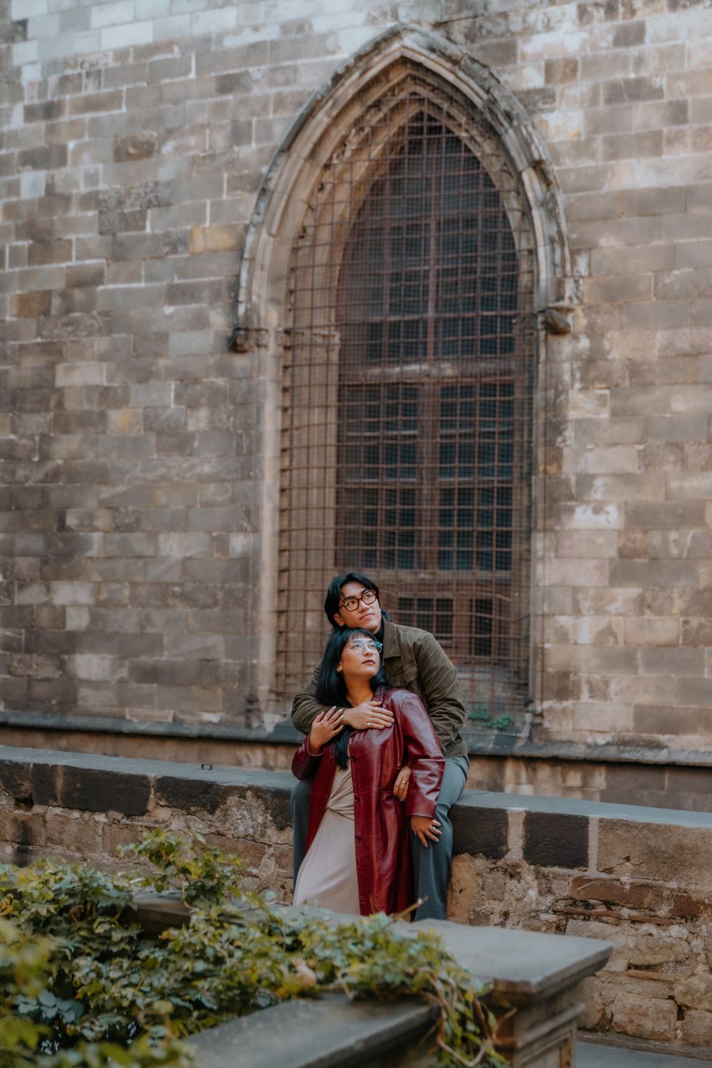 Loving couple walking narrow street winter Barcelona Honeymoon photoshoot Barcelona BarcelonaLoversPH
