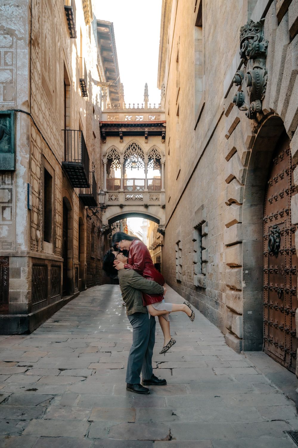 Joyful laughter in hidden Gothic alley Honeymoon photoshoot Barcelona BarcelonaLoversPH