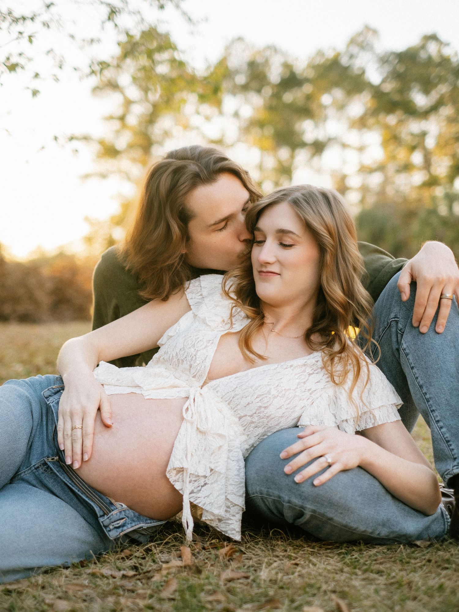 Outdoor maternity session in Jacksonville Florida with warm evening light and natural scenery