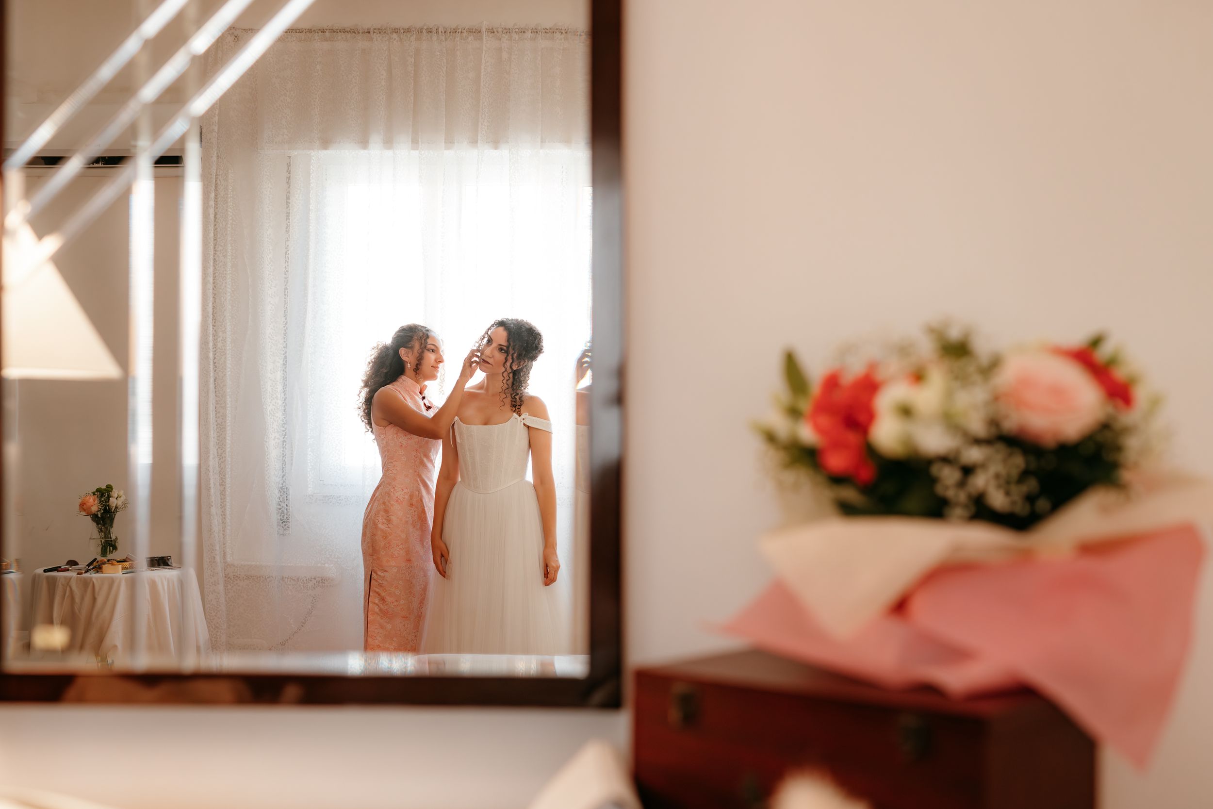 A collage of wedding day moments showing flowers, rings, and intimate details in soft pink and neutral tones.
