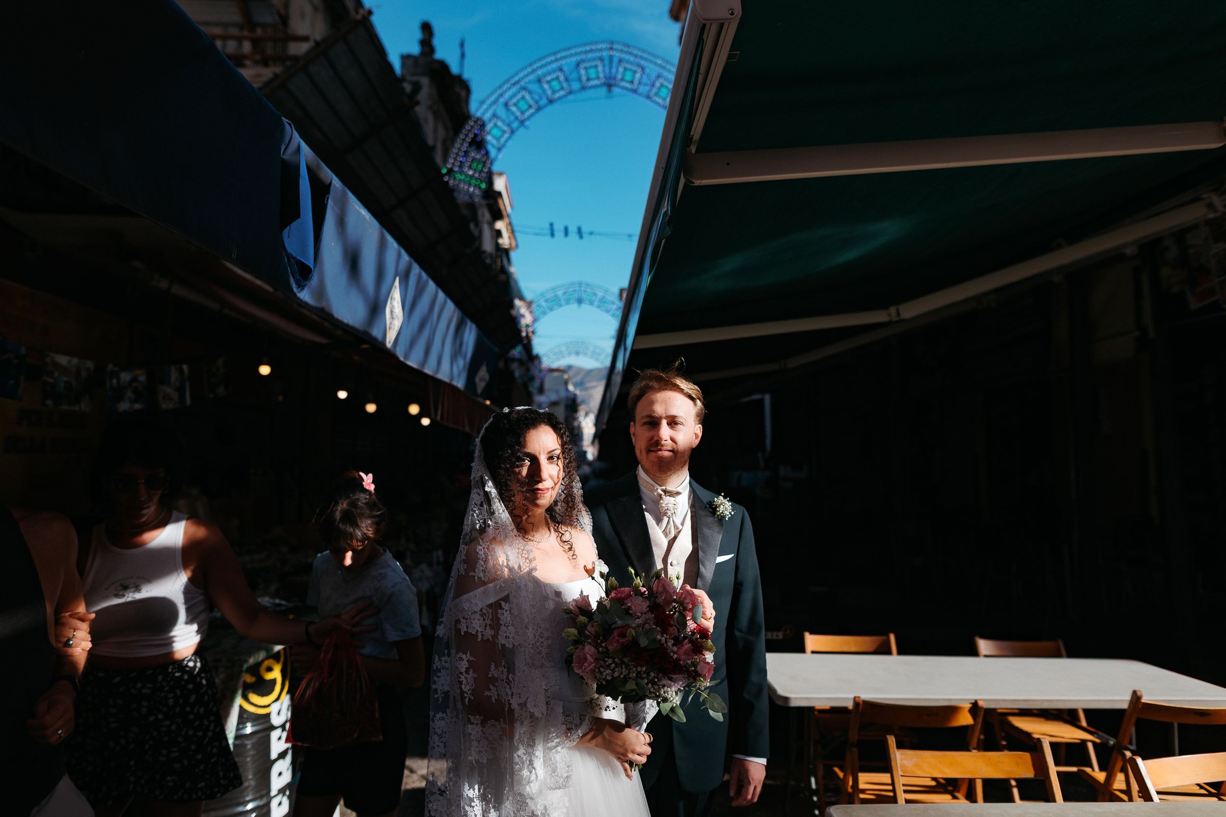 A collection of black and white wedding photographs showing couples and guests in various candid moments at a celebration.