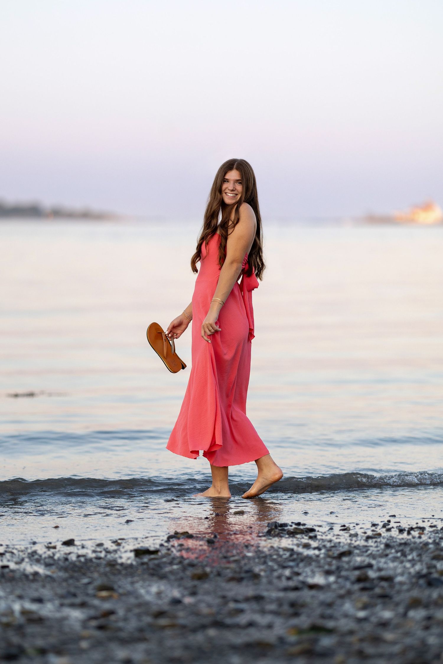 Senior portrait at sunset by the water New Castle, New Hampshire