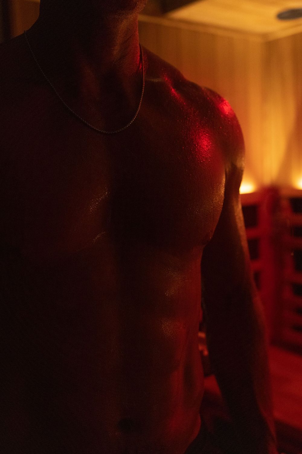 Warm-toned atmospheric shots of a sauna interior with golden lighting.