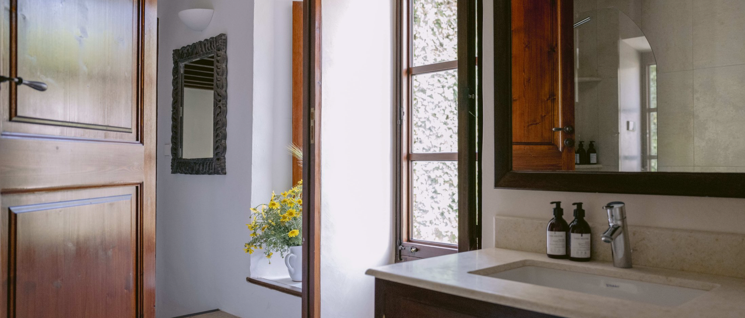 A series of interior home photos showing white walls, wooden doors, and windows in a hallway or room setting.