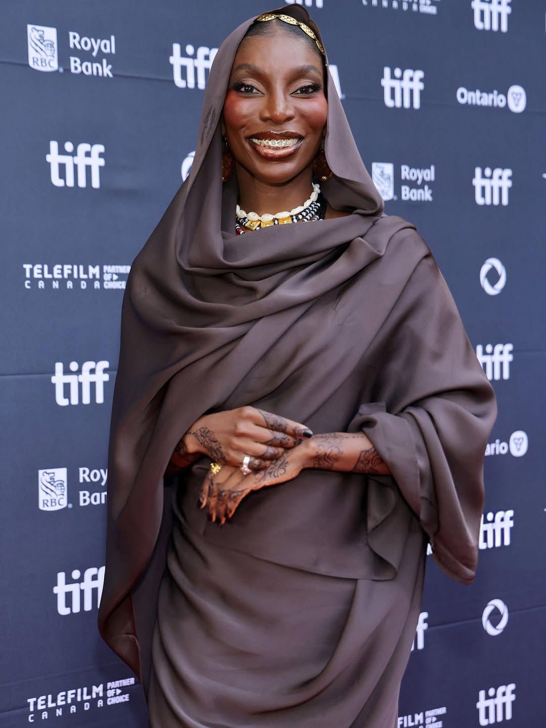 Michaela Coel - Toronto international film festival 2025 wearing Toub by Hiba Rahma and gold jewellery by Kuku Jewellery - photo Vogue Mag