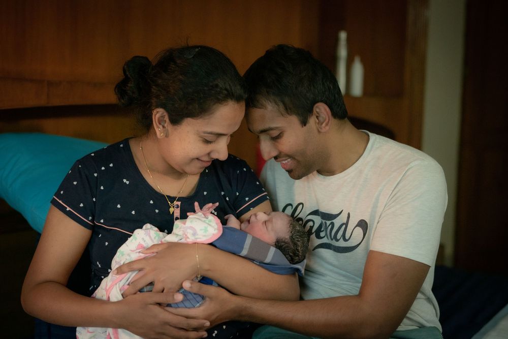Parents sharing their first cuddle with baby shortly after birth