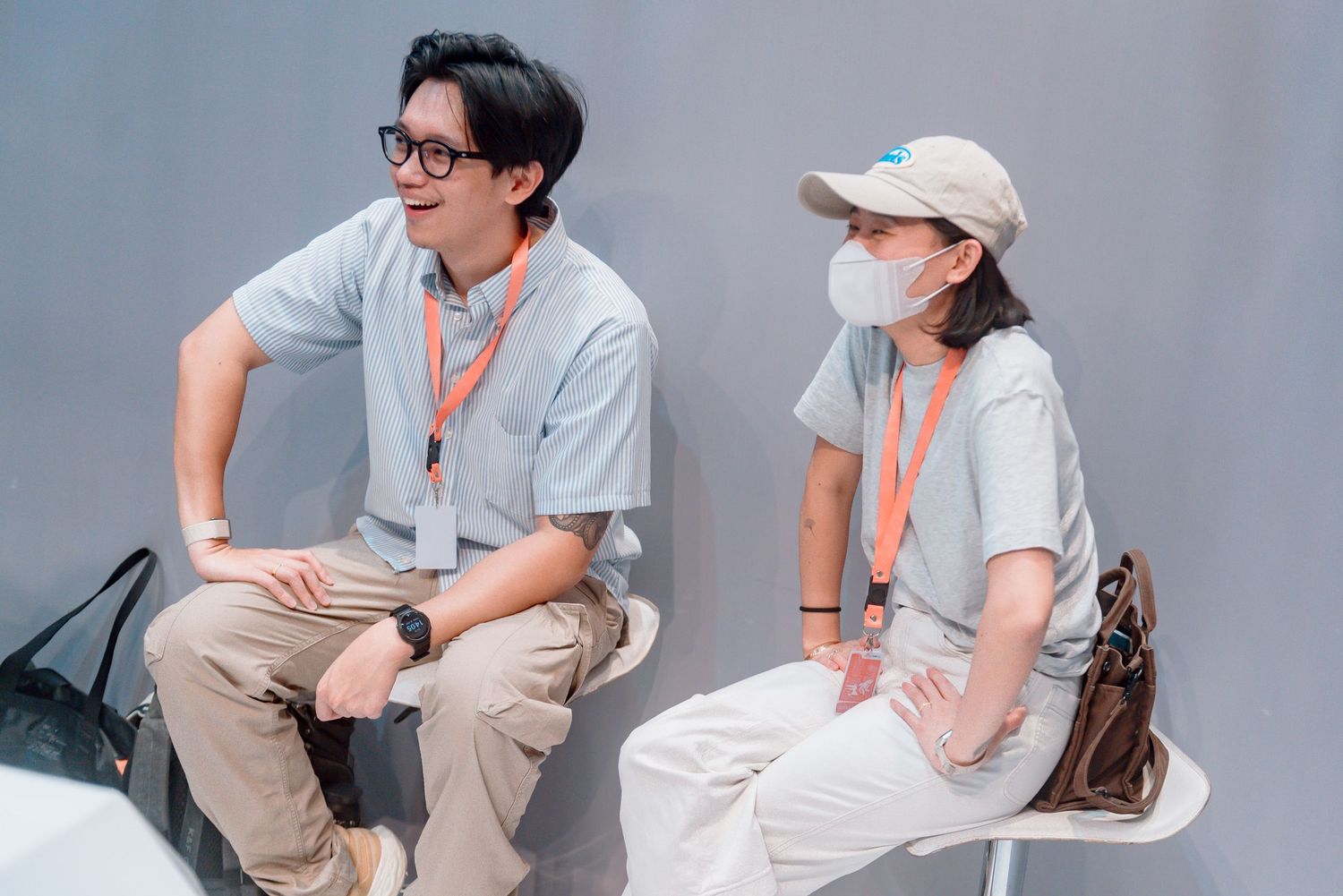 A series of photos showing people sitting in white chairs and having casual conversations in an office setting.
