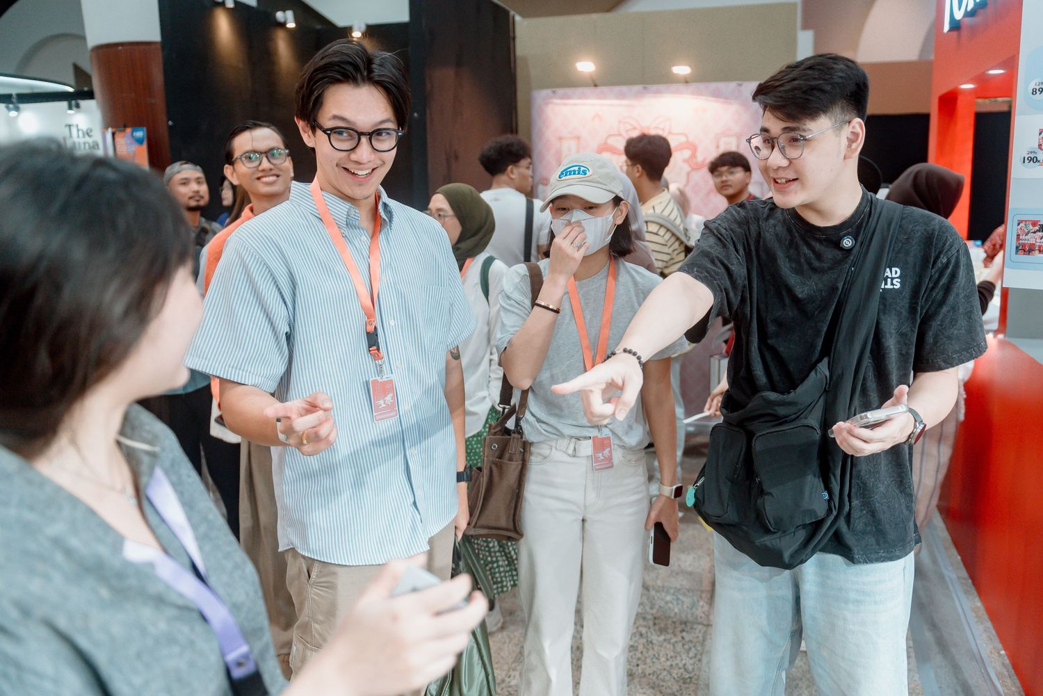 A group of people having animated conversations at a professional networking event in an office space.