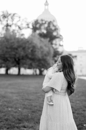 black and white photo go mother and daughter in front of of capitol building in washington dc