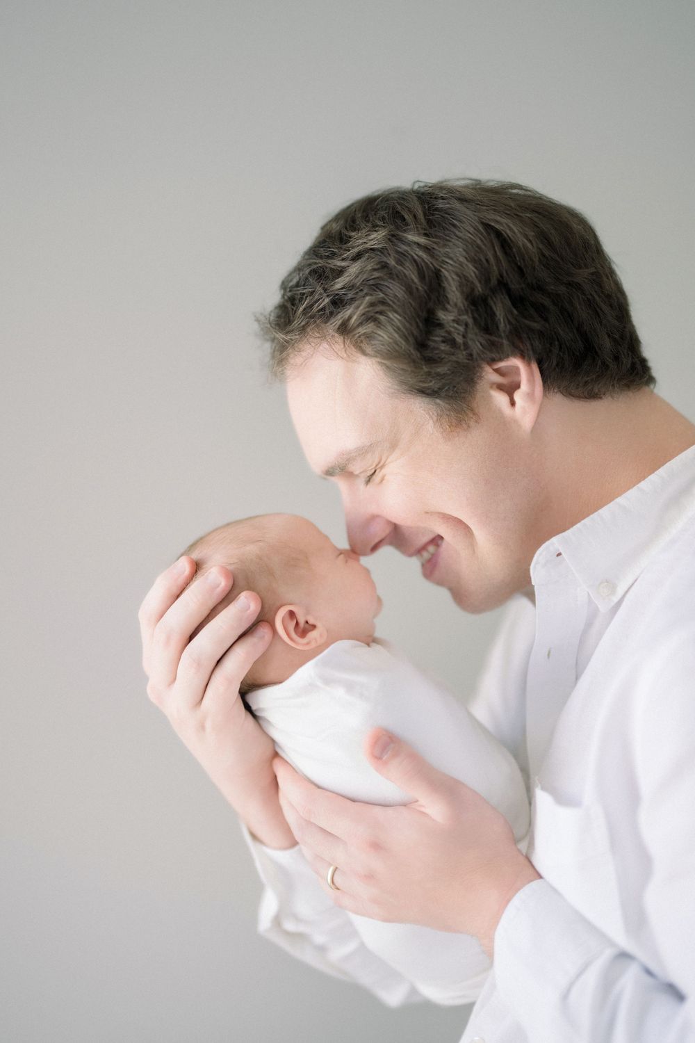 a father and baby at a newborn session in washington dc