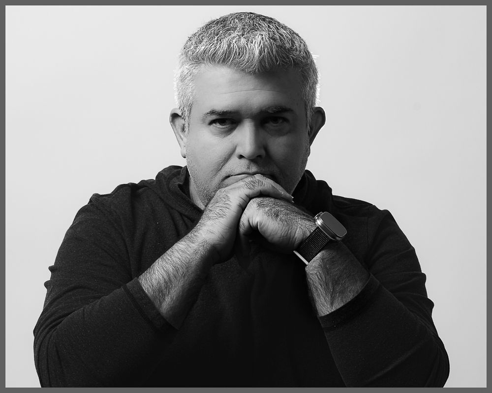 black and white headshot of a man smiling. Portrait studio session. Southern California photography session. OC photographer.