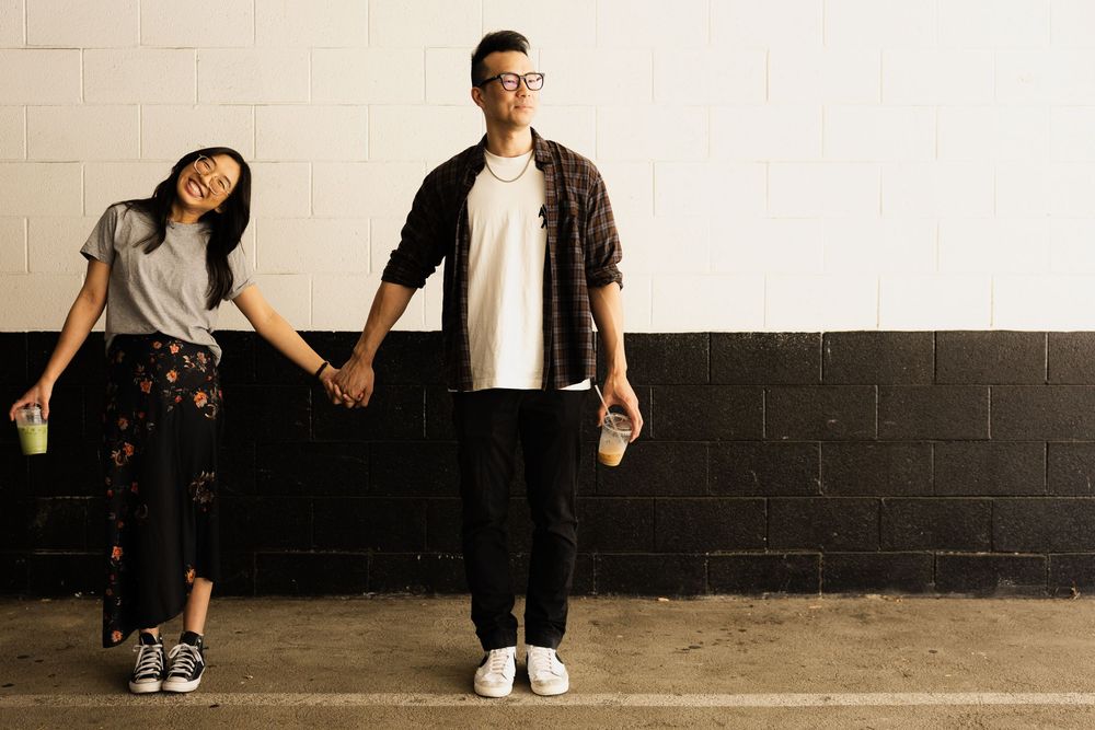 Two couples holding hands during couples casual photoshoot in Brea California with OC photographer.