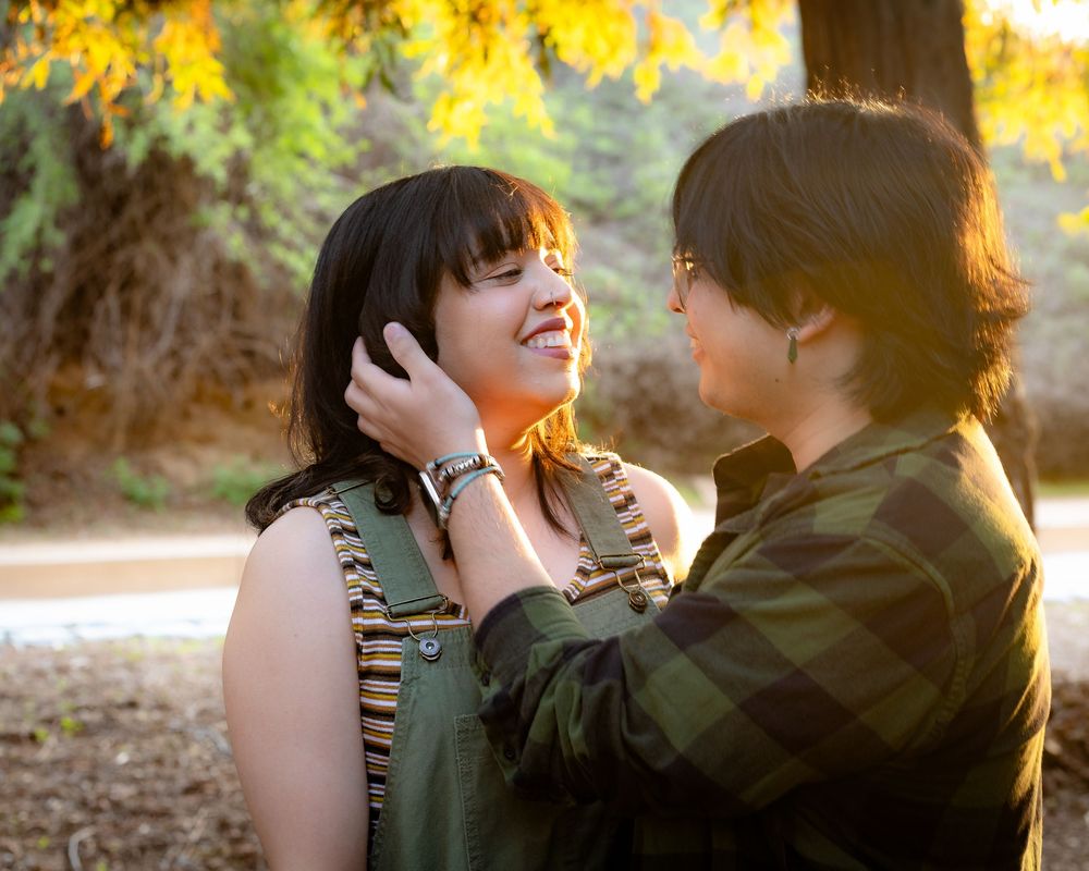 Young couple among the sunset in the woods. Yorba Linda, natural light photographer. Couples session. Posing, young couples.