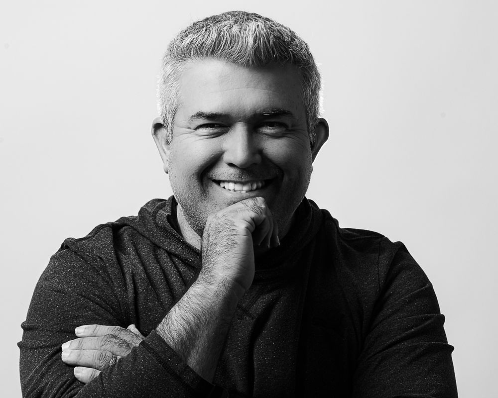 black and white headshot of a man smiling. Portrait studio session. Southern California photography session. OC photographer.