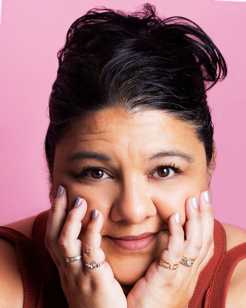 beauty shot of a women with a pink backdrop. Colorful Portrait studio session. Southern California photographer
