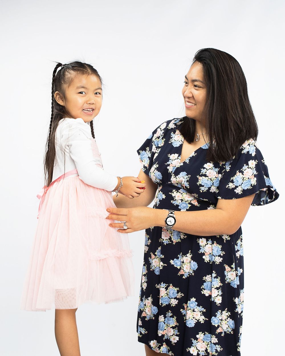 Mother and Daughter pose during family photo session with OC photographer.