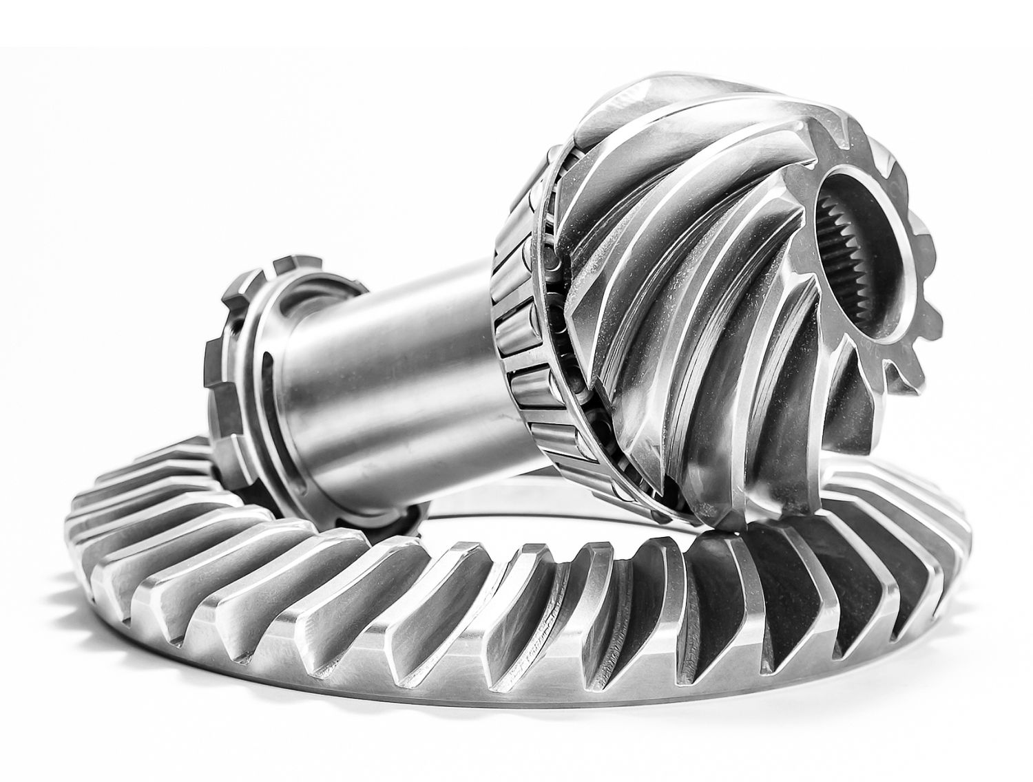 Close-up of industrial spiral bevel gears showing detailed metallic tooth patterns.