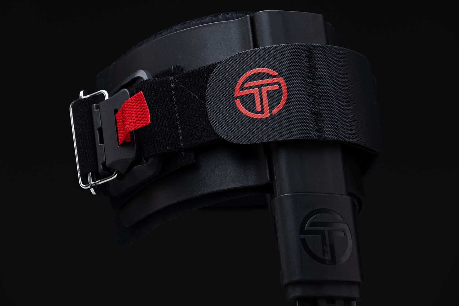 Product photography of sleek black gaming headset details against dark background.