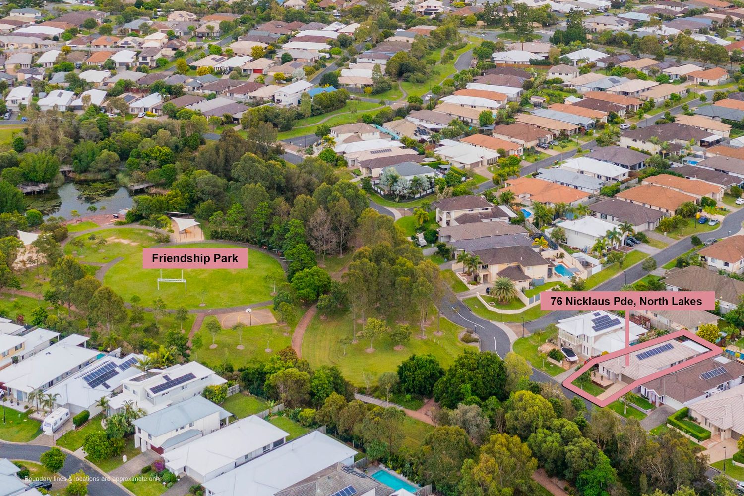 Aerial drone view of North Lakes residential area highlighting Friendship Park and 76 Nicklaus Place property location.