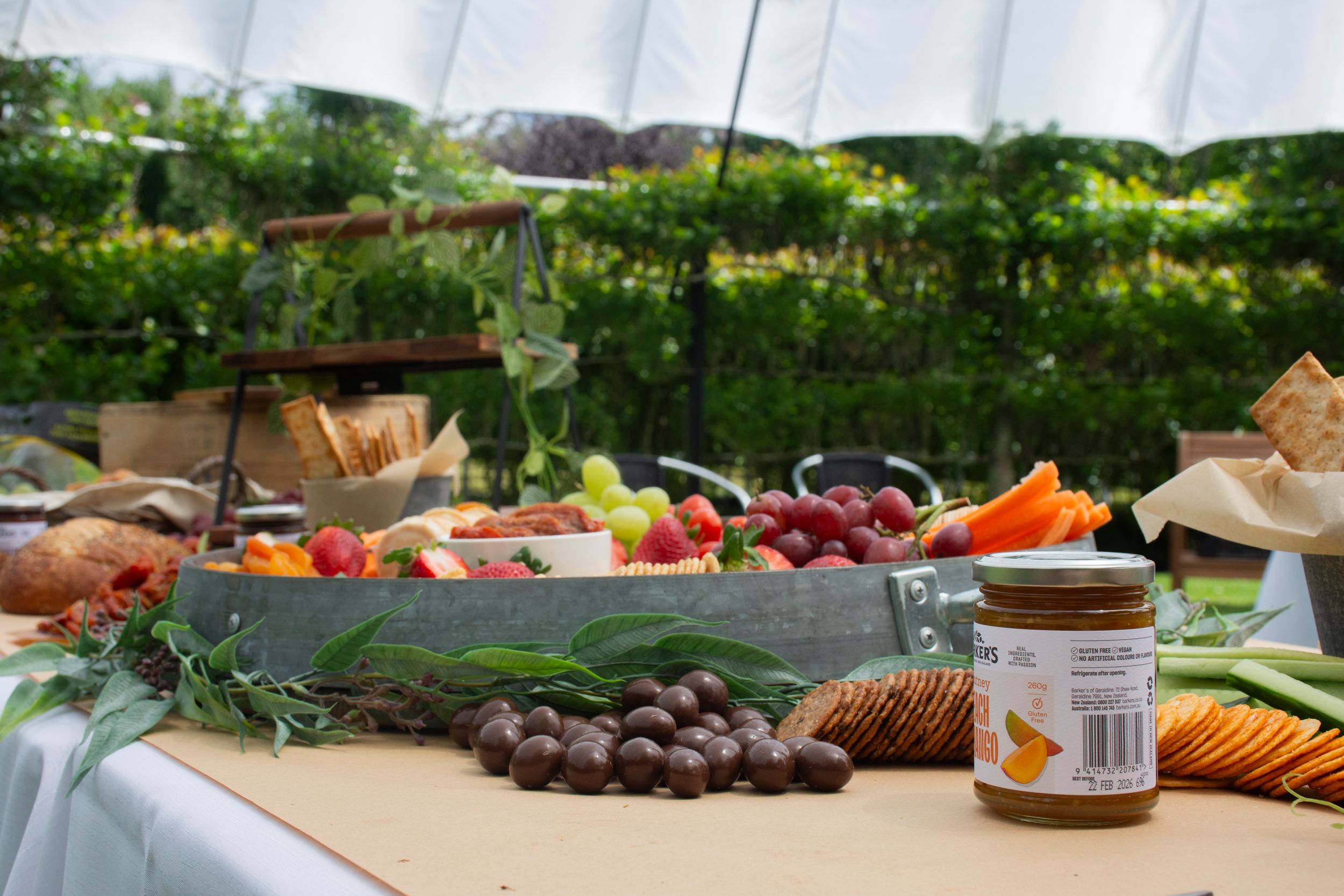 Lola Caravan Catering’s signature wedding grazing table with gourmet selections by Stay&cee Creative