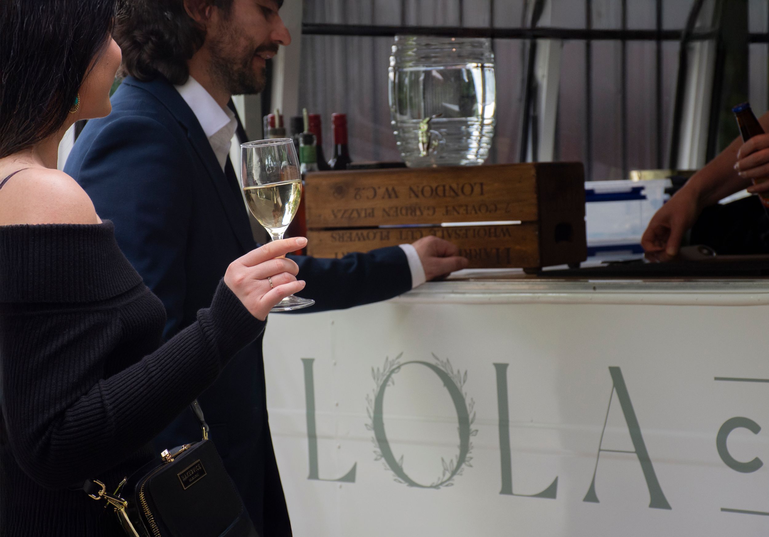 Rustic wedding catering setup featuring Lola Caravan’s grazing table by Stay&cee Creative
