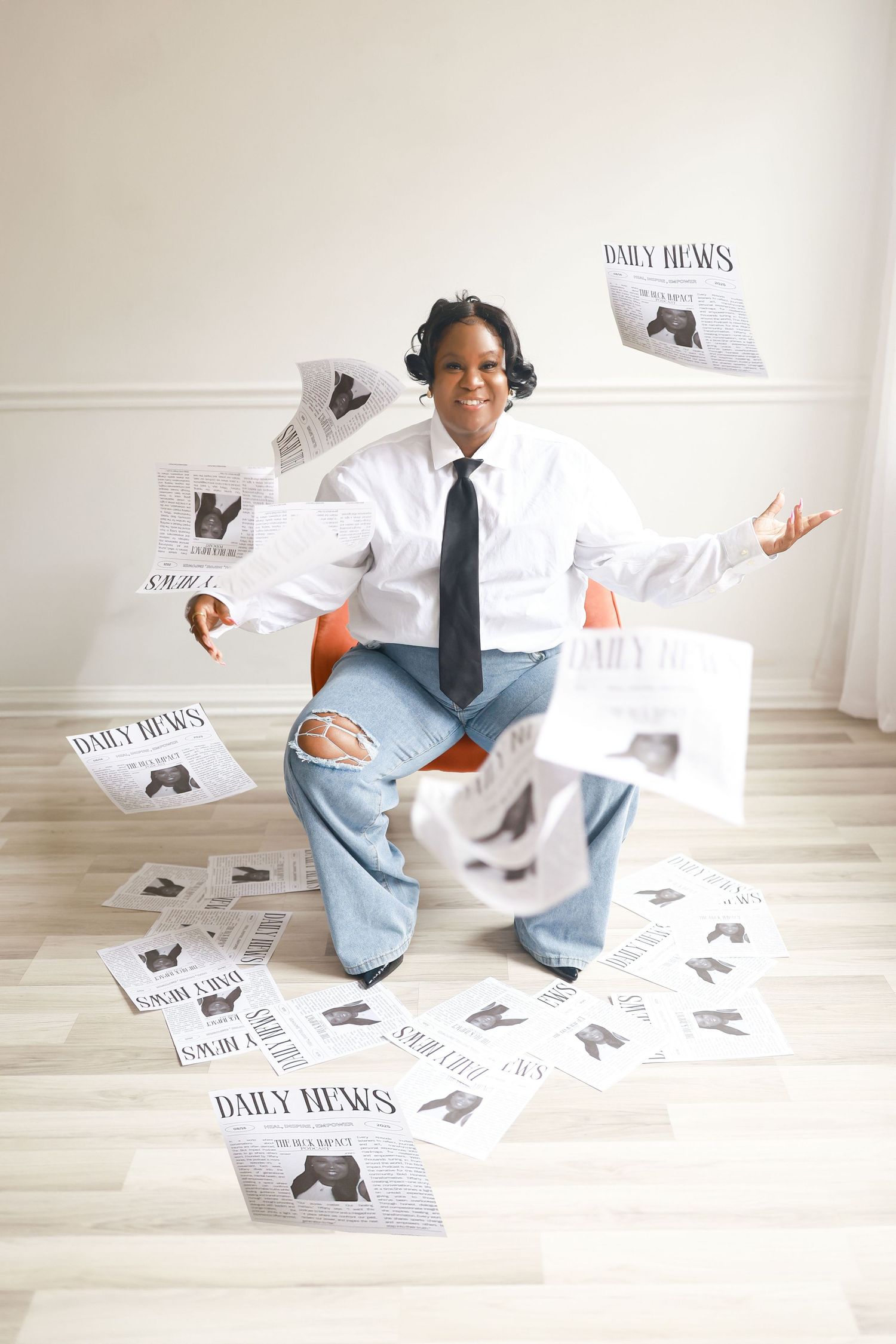 A series of photos showing someone in business attire interacting with scattered newspaper pages on a light wooden floor.