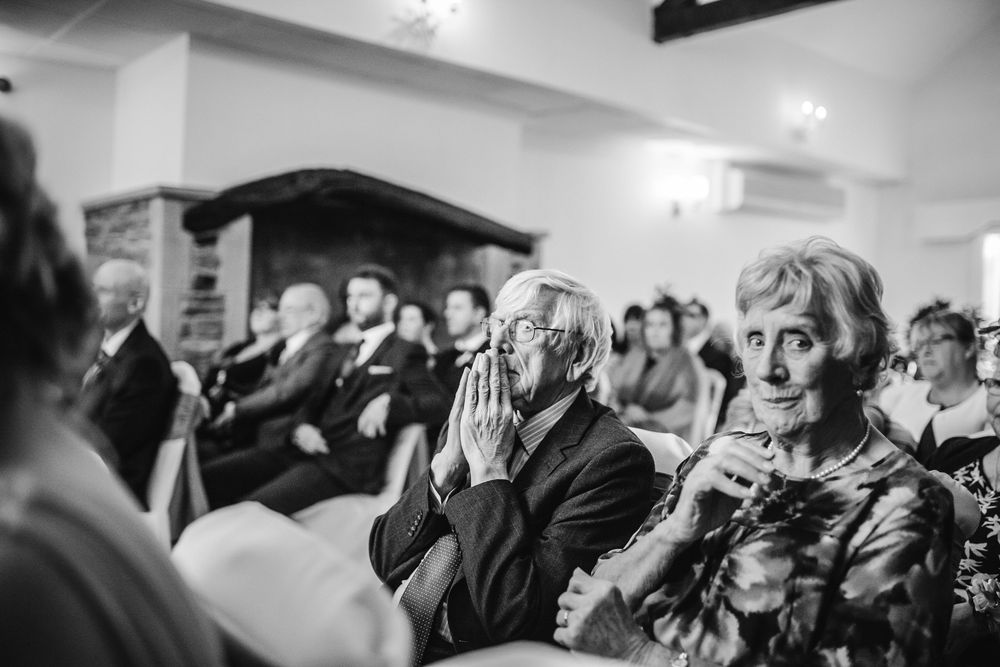 grandad is overcome with happy emotion watching the couple take their wedding vows