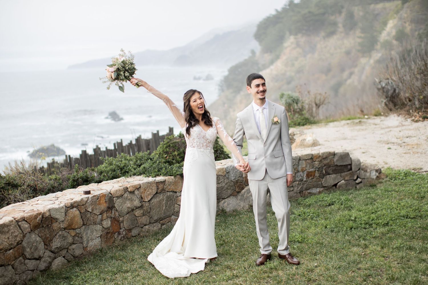Couple celebrating their love in Big Sur on the coast of California overlooking the ocean.