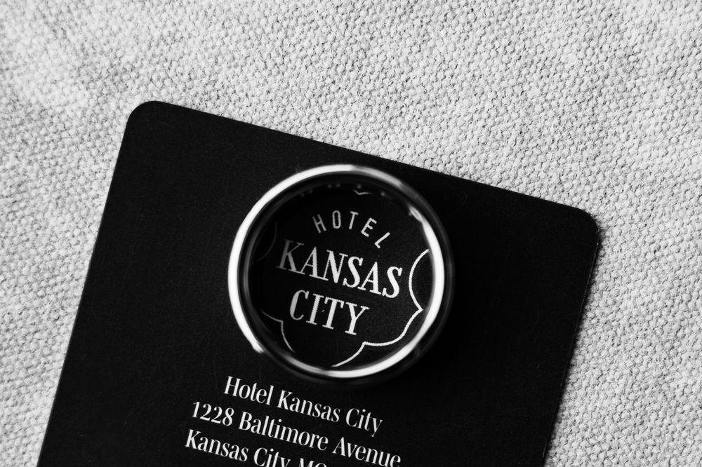 A black business card featuring the Hotel Kansas City logo and branding in white text on a dark background.