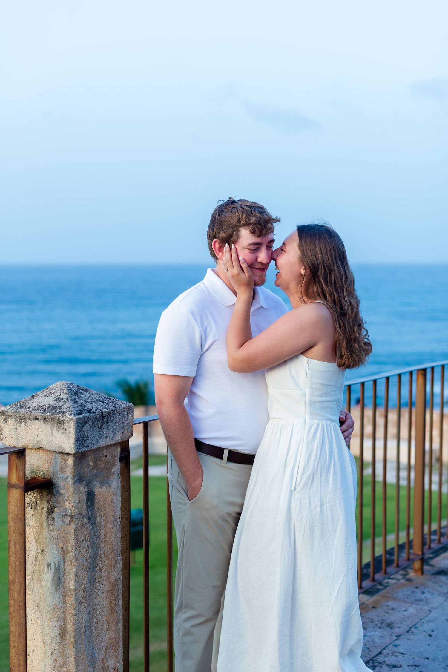 Couples portrait with the ocean in the background. Engagement photo session in Old San Juan, Puerto Rico.