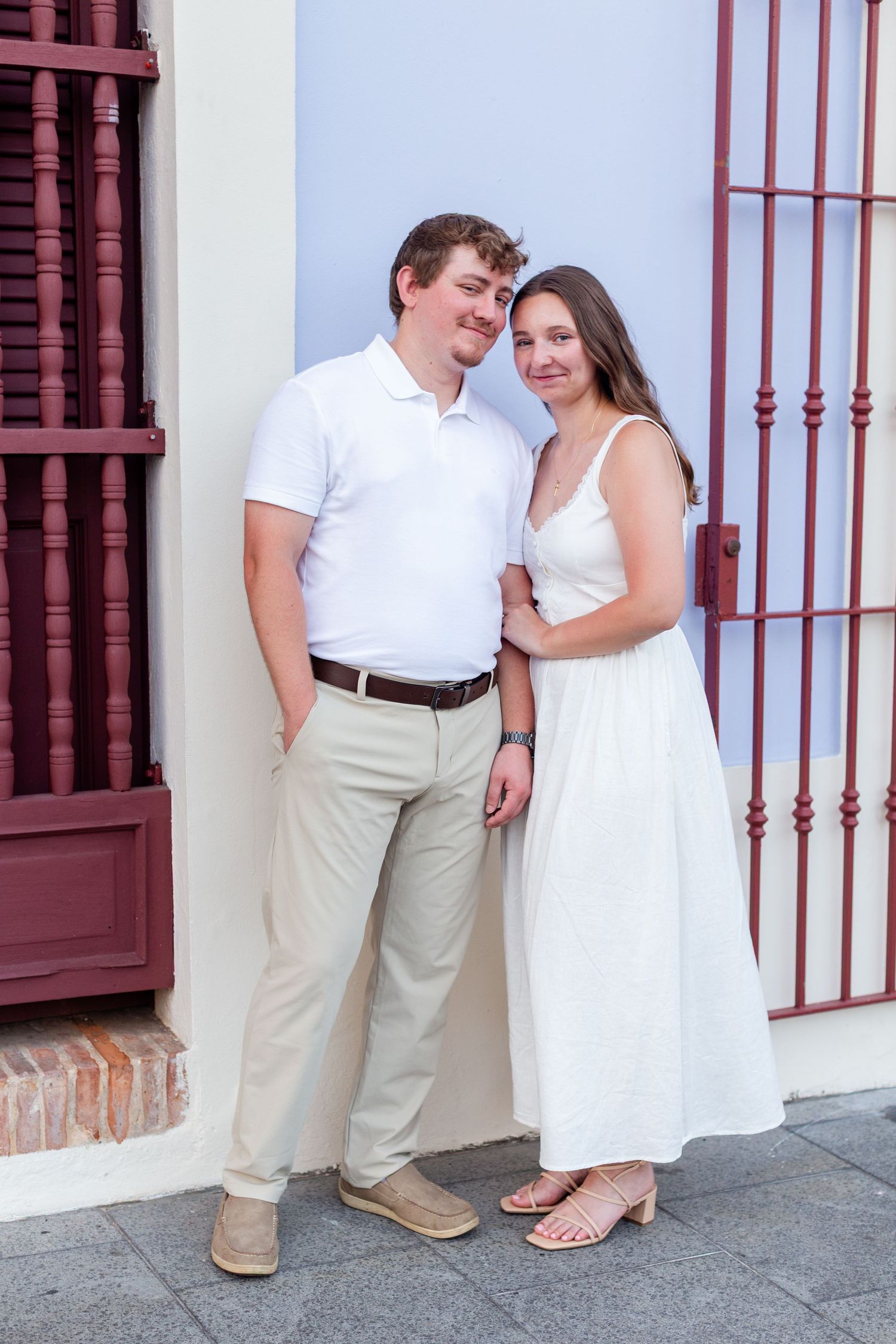 Full-body couples portrait. Engagement photo session in Old San Juan, Puerto Rico.