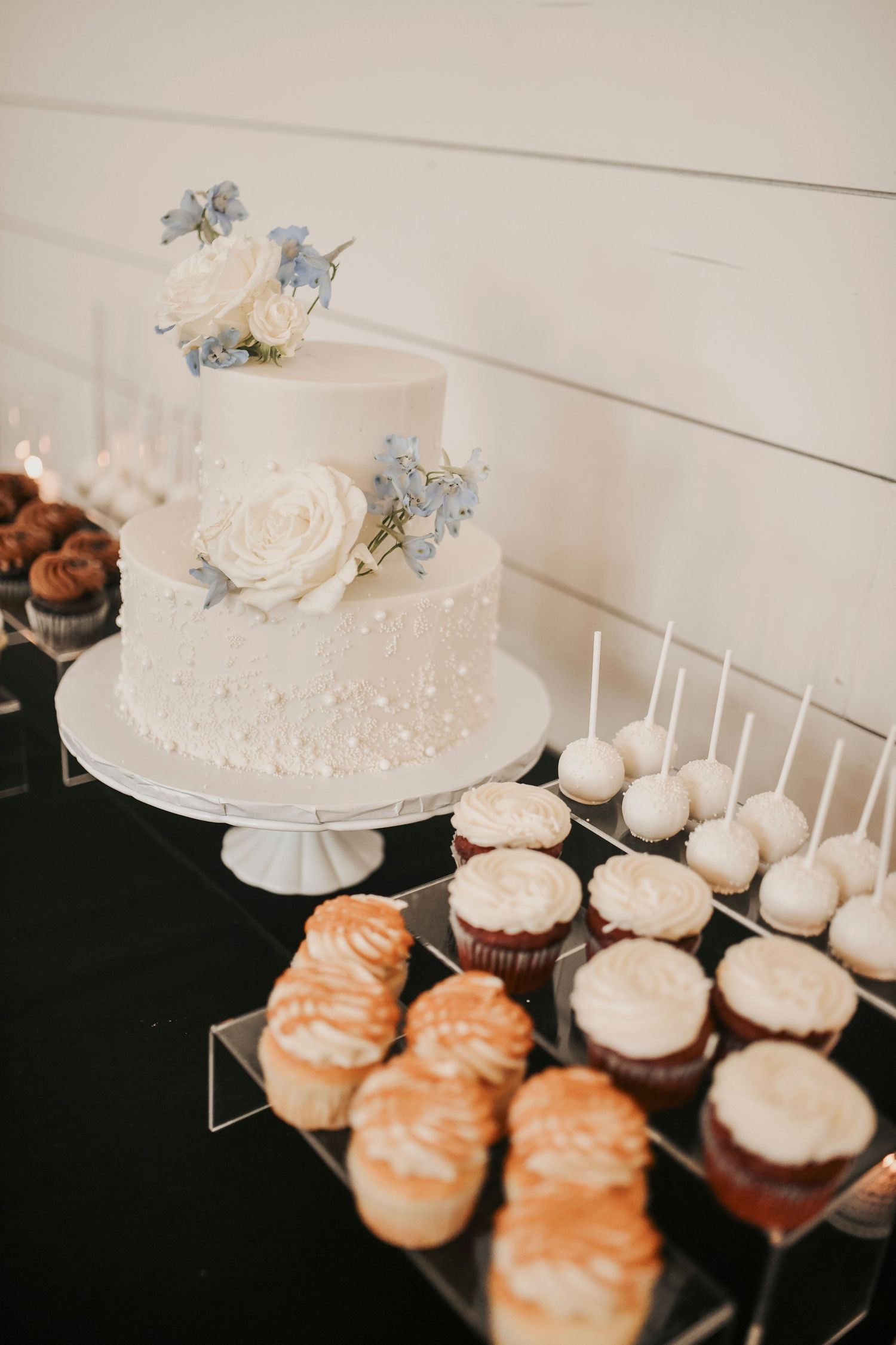 Newlyweds share cake cutting moment during reception