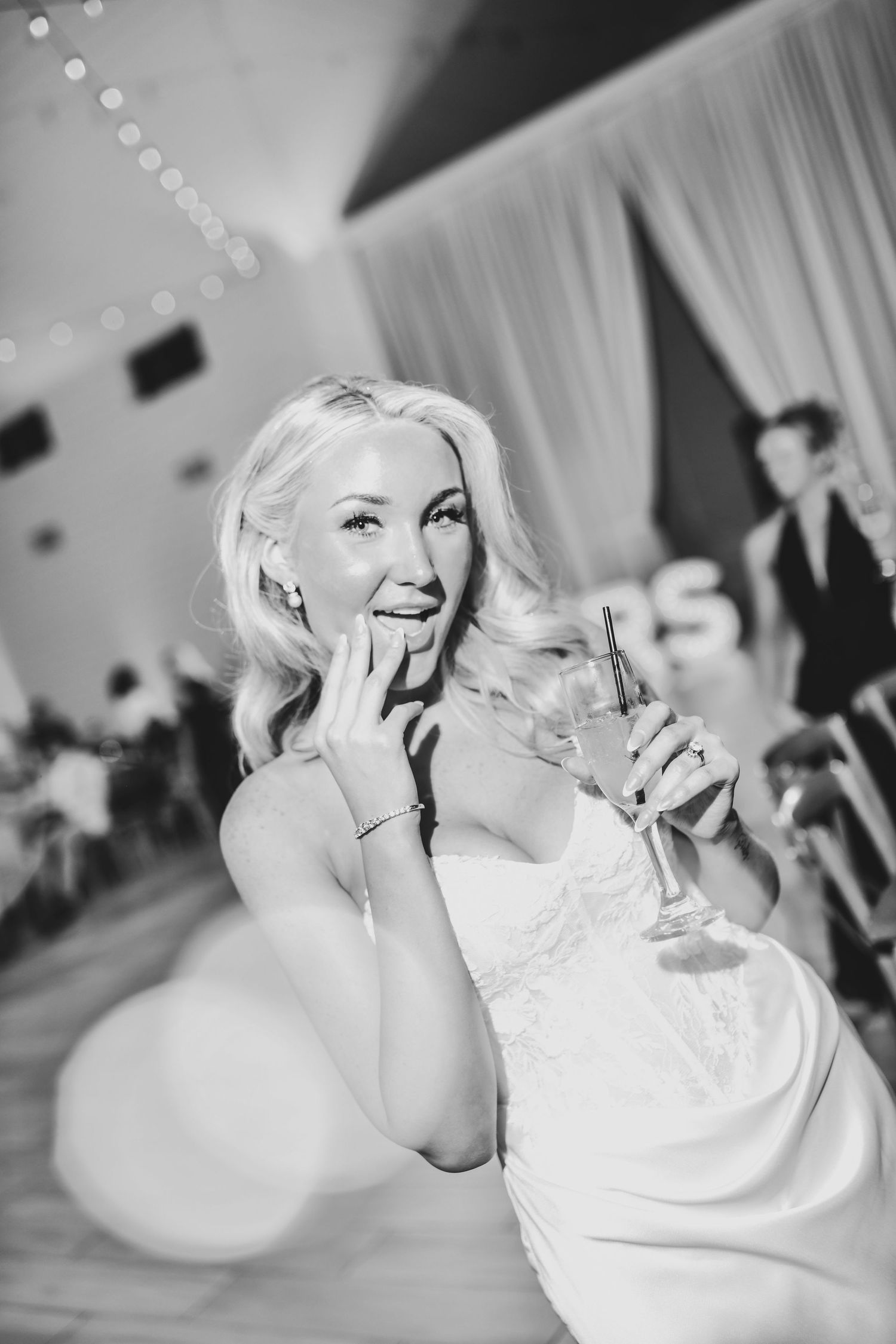 Bride dancing joyfully during wedding reception celebration